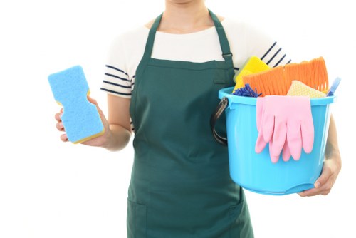 Carpet cleaning technician preparing safety equipment in Kingston Vale