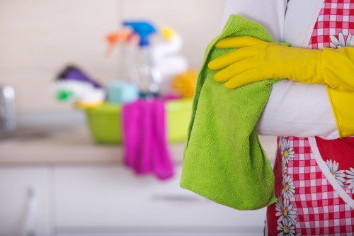 Technician cleaning a carpeted area with extraction equipment
